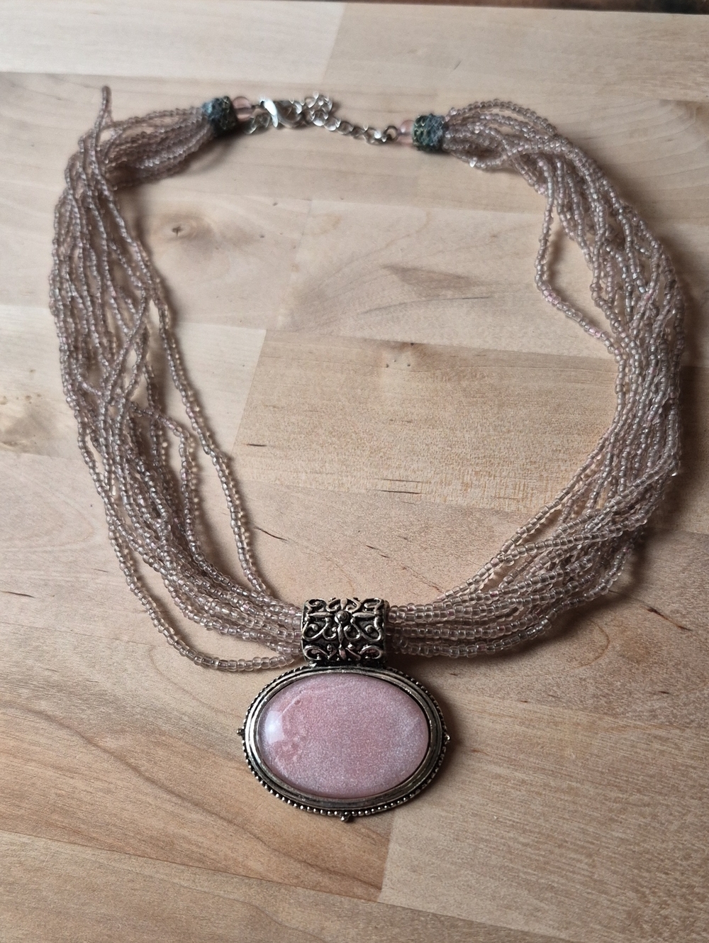 Multi-Strand Beige and Pink Beaded Necklace with Pink Oval Pendant